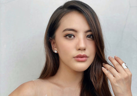 Model wearing a cubic zirconia hammered cuff ring from Hill to Street